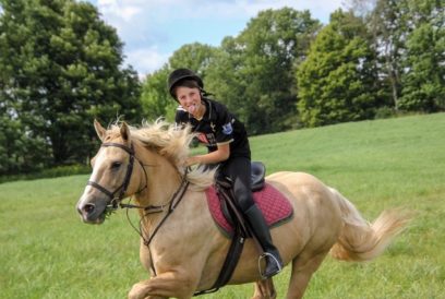 boy riding horse having fun