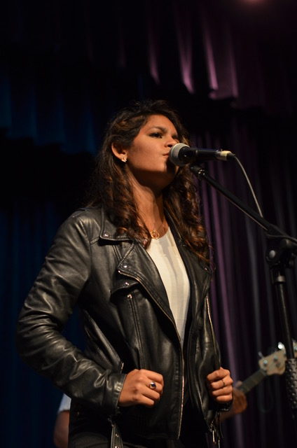 woman singing at microphone