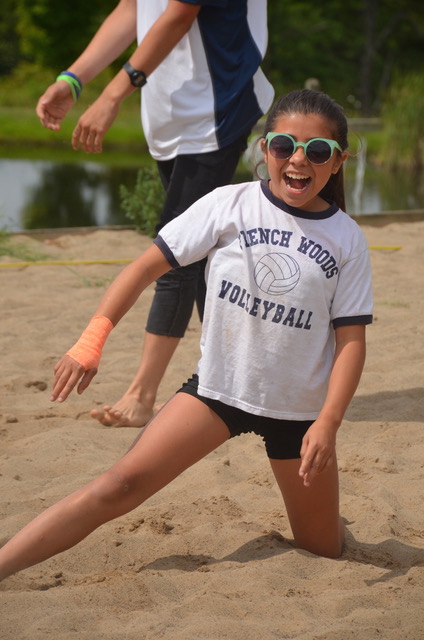 girl in sand from diving in volleyball