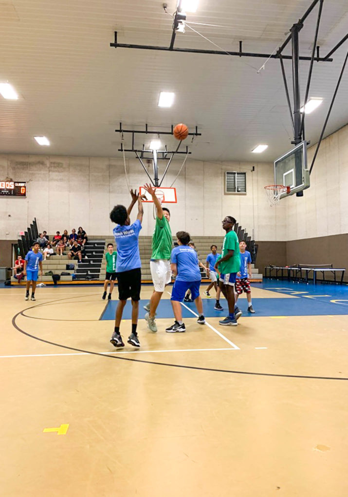 Campers playing a basketball game