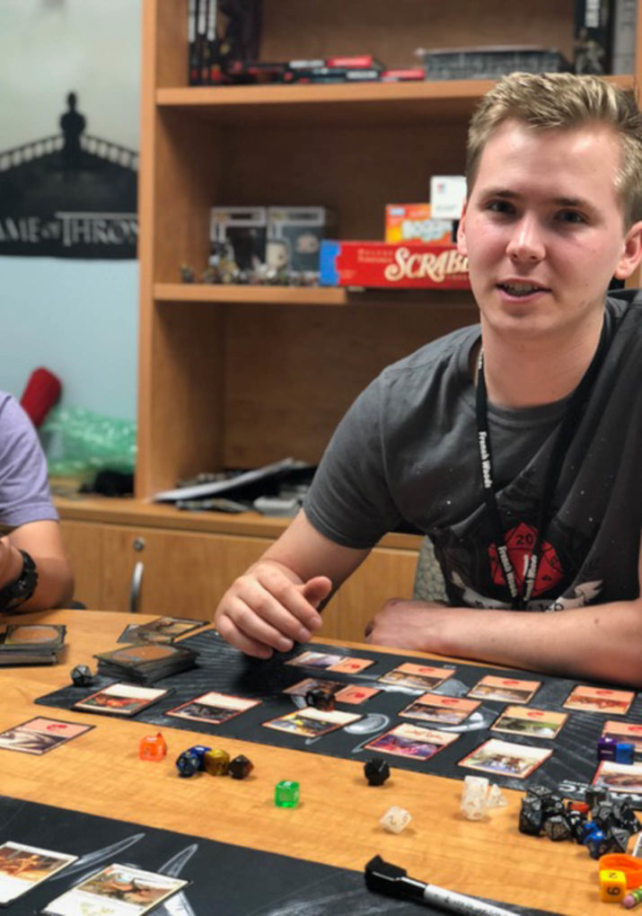 Boy playing a table top role playing game