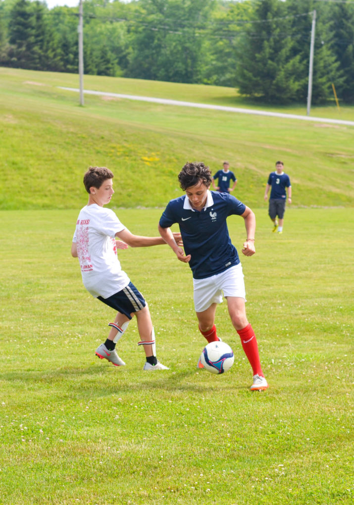 Campers playing a soccer game