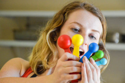 Camper excitedly looking at measuring spoons