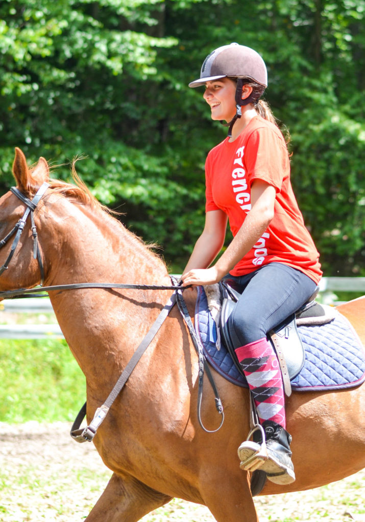 Camper riding a horse