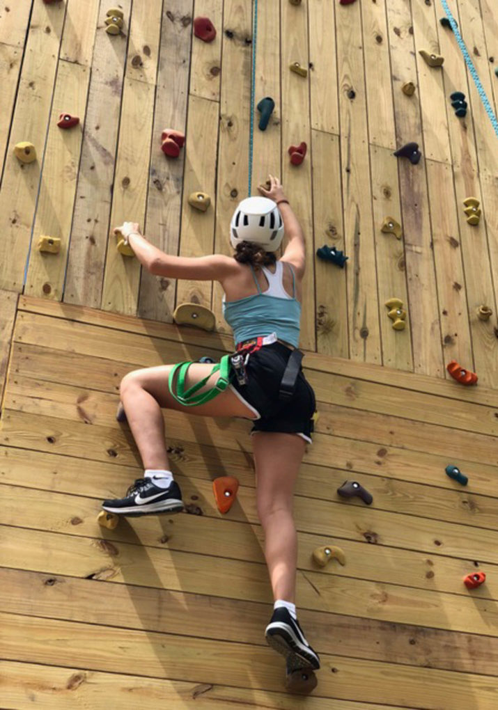 Camper climbing the rock wall