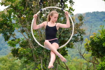 Camper sitting in a ring hanging in the air