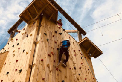 Camper climbing the rock wall