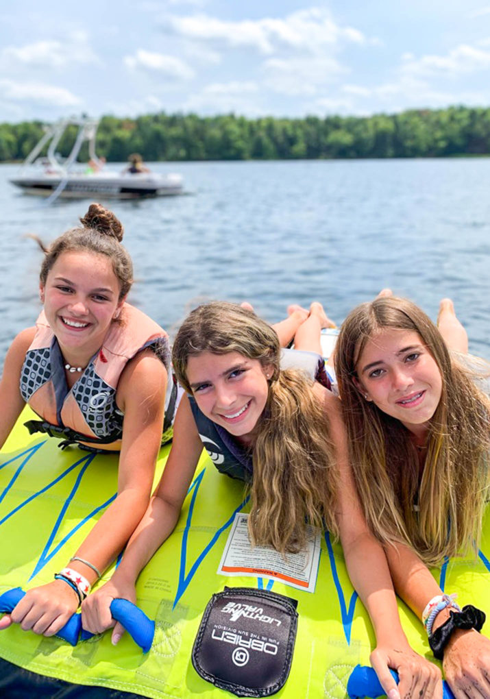 Three campers on a tube