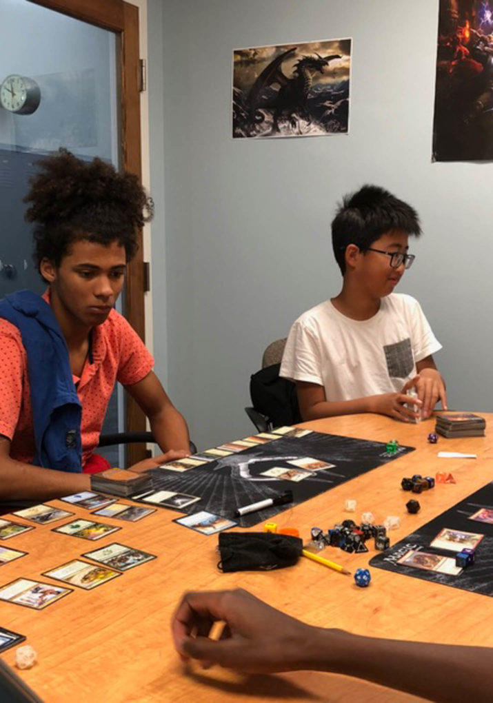 Two boys playing a table top role playing game