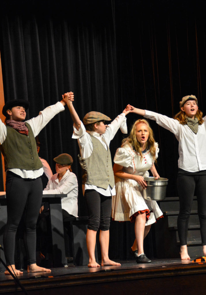 Students during a theater performance on stage