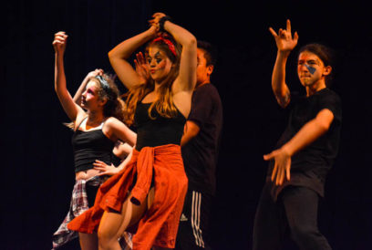 Dancers dancing during a performance on stage