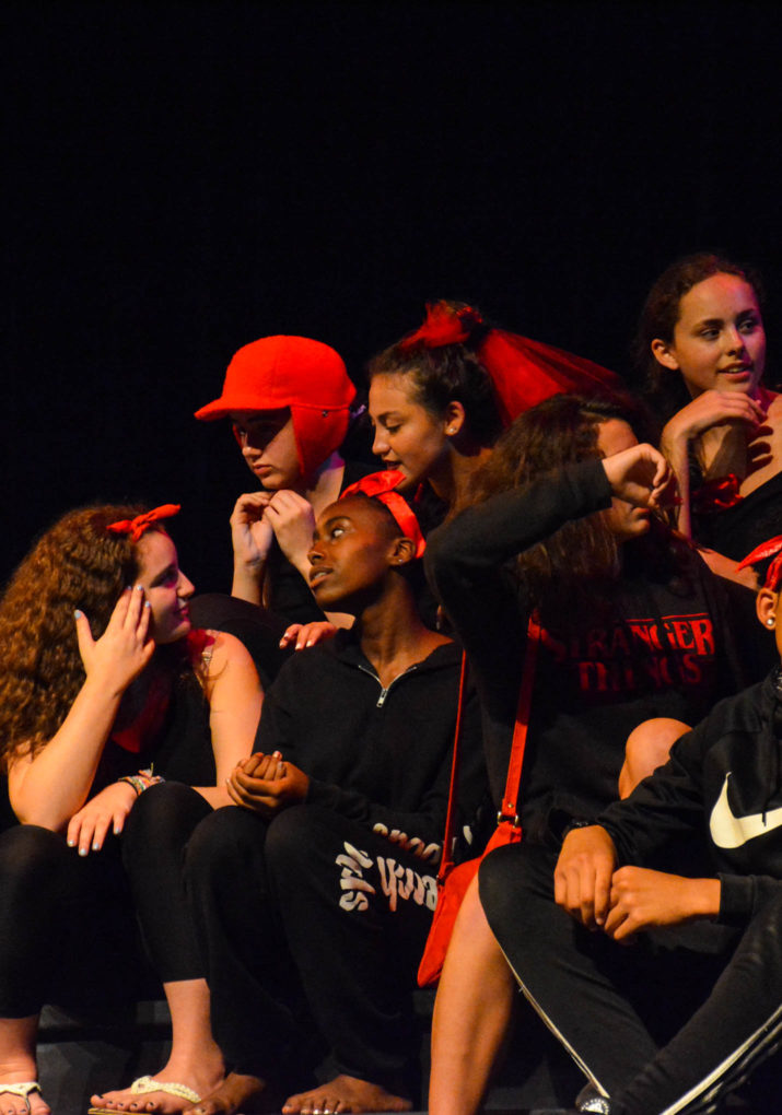 Group of campers on stage performing