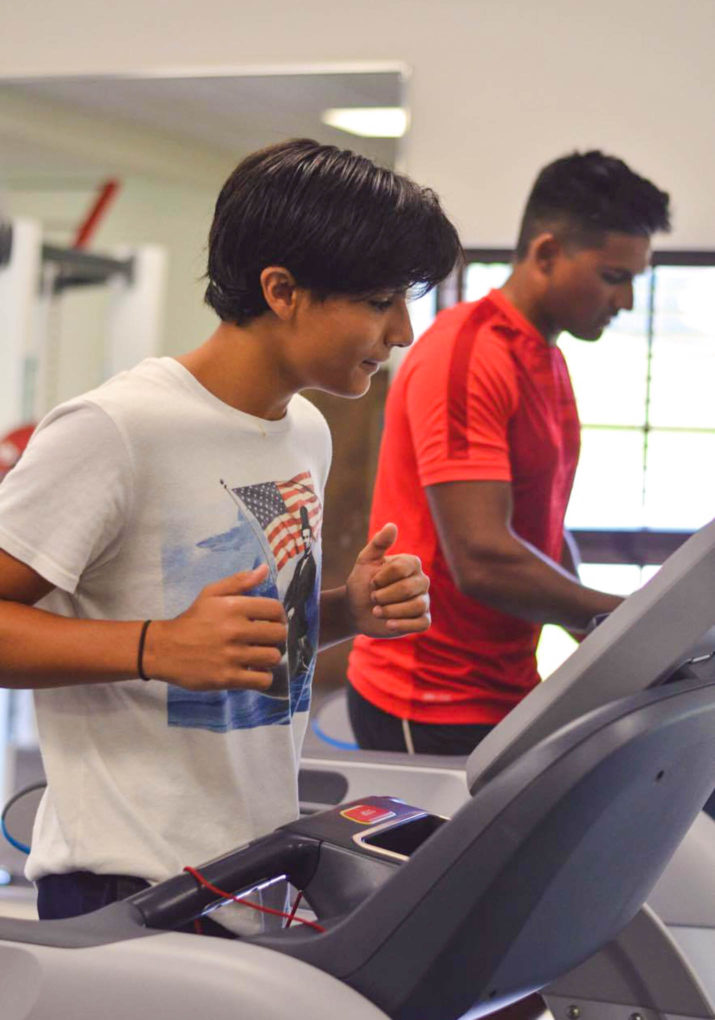 Boys running on treadmills