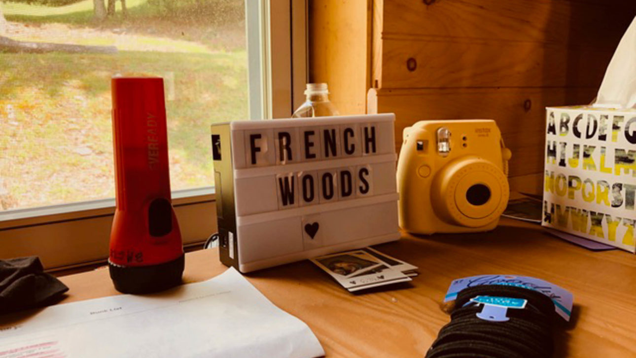 Small marquee sign with French Woods on it