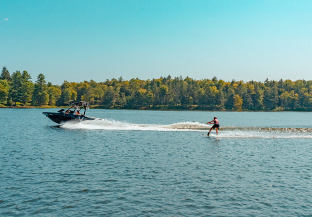 A teen camper water skiing on the French Woods lake at summer camp