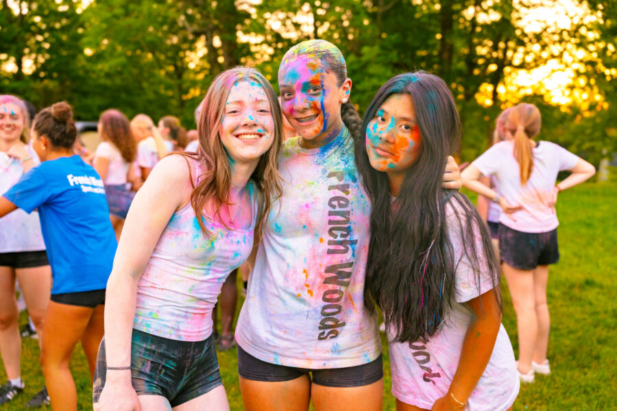 A group of teen girls wearing French Woods Sports and Arts t-shirts during a summer camp color run party