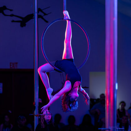 Teen girl performing on the lyra at a summer camp show day