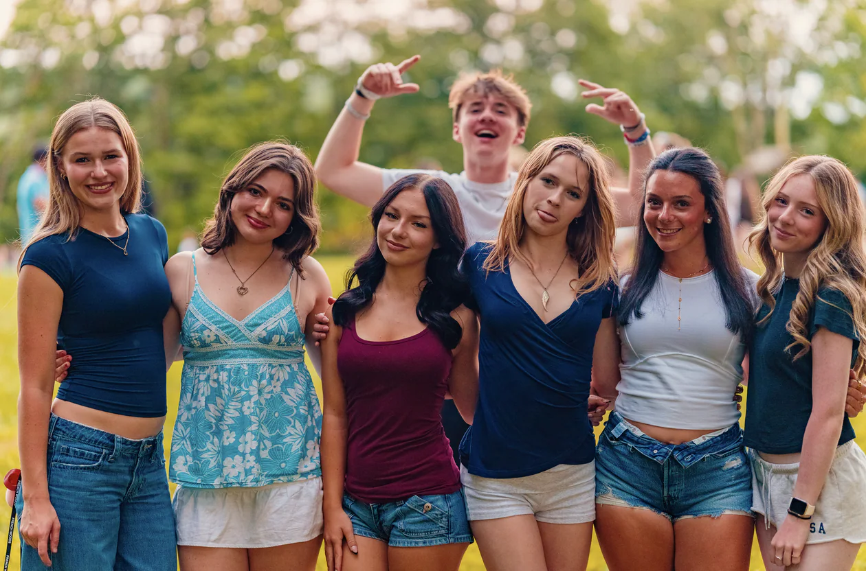Teen campers gathering around a campfire at New York Teen Camp
