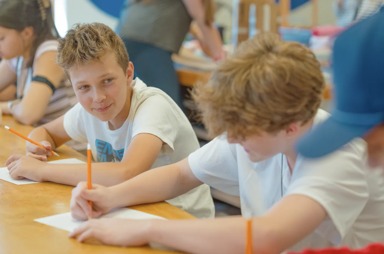 A teen camper creating artwork during a visual arts activity at New York Teen Camp